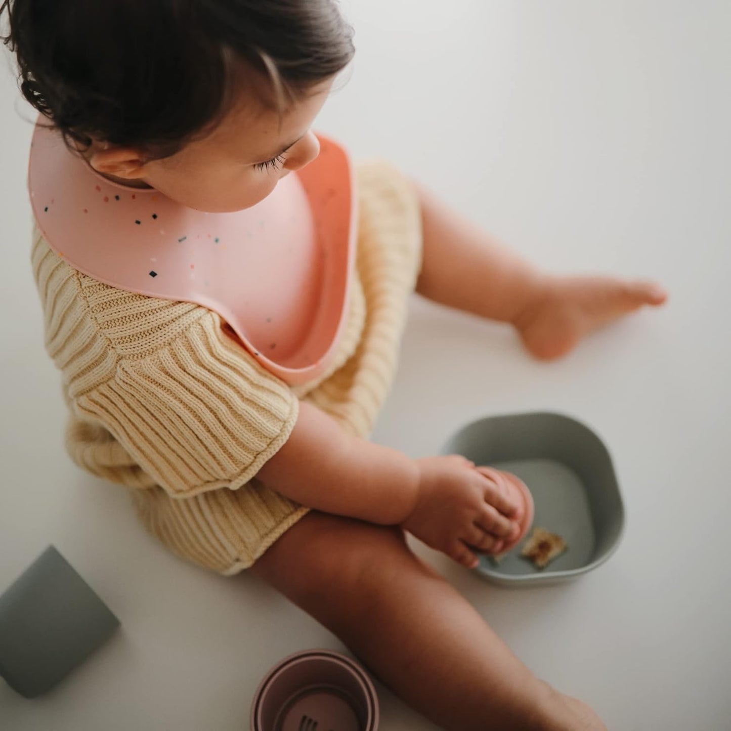 mushie Silicone Baby Bib | Adjustable Fit Waterproof Bibs (Powder Pink Confetti)